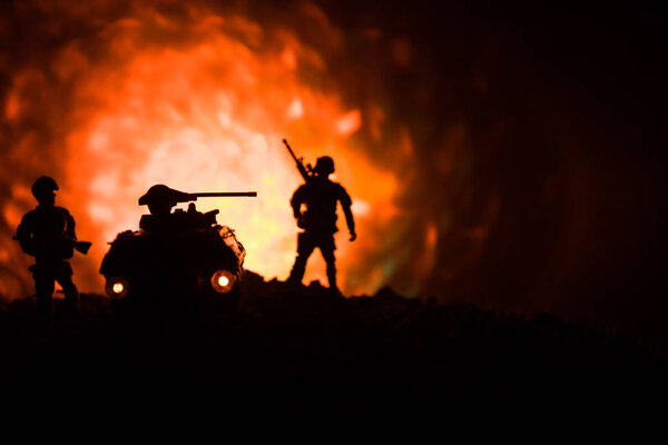 War Concept. Military silhouettes fighting scene on war fog sky background, World War German Tanks Silhouettes Below Cloudy Skyline At night. Armored vehicles. Tanks battle