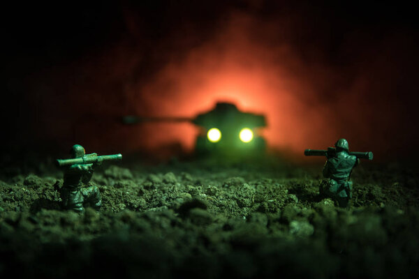 War Concept. Military silhouettes fighting scene on war fog sky background, World War Soldiers Silhouettes Below Cloudy Skyline At night. Attack scene. Armored vehicles. Tanks battle.