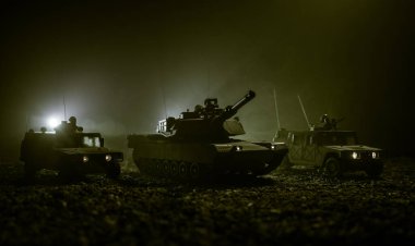 Military patrol car on sunset background. Army war concept. Silhouette of armored vehicle with soldiers ready to attack. Artwork decoration. Selective focus clipart