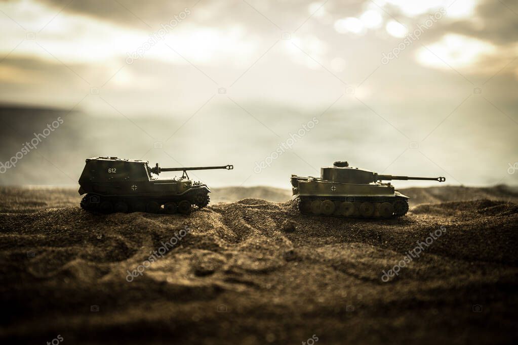 War Concept. Military silhouettes fighting scene on war fog sky background, World War German Tanks Silhouettes Below Cloudy Skyline At night. Attack scene.