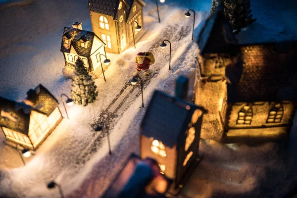 New Year miniature house in the snow at night with fir tree. — 图库照片