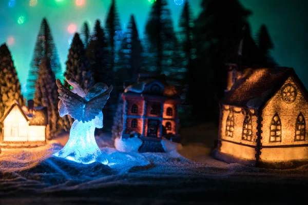 New Year miniature house in the snow at night with fir tree. — 图库照片