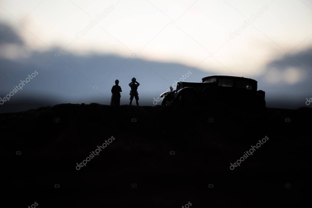 War concept. Creative composition. Silhouette of German general at the desert. Army commanders watching to the battle.