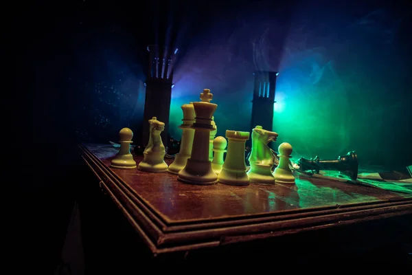 Chess figures on a dark background with smoke and fog. Selective focus — Stock Photo, Image