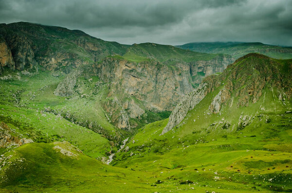 Cycling mountain road. Misty mountain road in high mountains.. Cloudy sky with mountain road. Azerbaijan nature