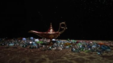 Lamp of wishes concept. Silhouette of a man standing in the middle of the road on a misty night with giant Antique Aladdin arabian nights genie style oil lamp. Creative artwork decoration