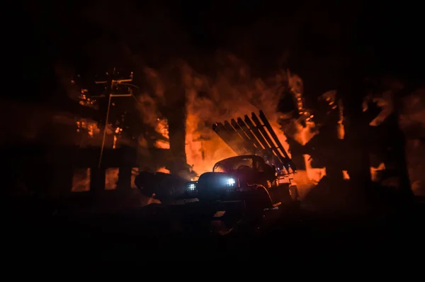 Rocket launch with fire clouds. Battle scene with rocket Missiles with Warhead Aimed at Gloomy Sky at night. Soviet rocket launcher on War Background. Creative composition.