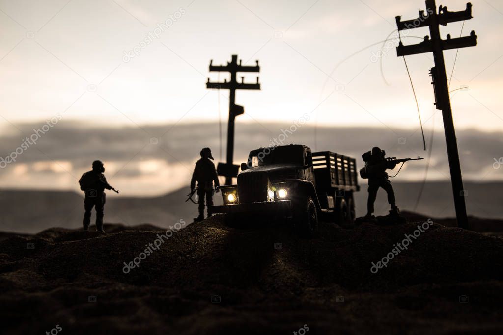 War Concept. Military silhouettes fighting scene on war fog sky background, World War Soldiers Silhouette Below Cloudy Skyline sunset. Selective focus