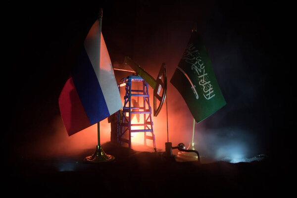 Деловой диалог, концепция нефтяного соглашения: Государственные флаги с нефтяным насосом и нефтеперерабатывающим заводом ночью. Энергетическая промышленная концепция. Выборочный фокус. Декорации
.