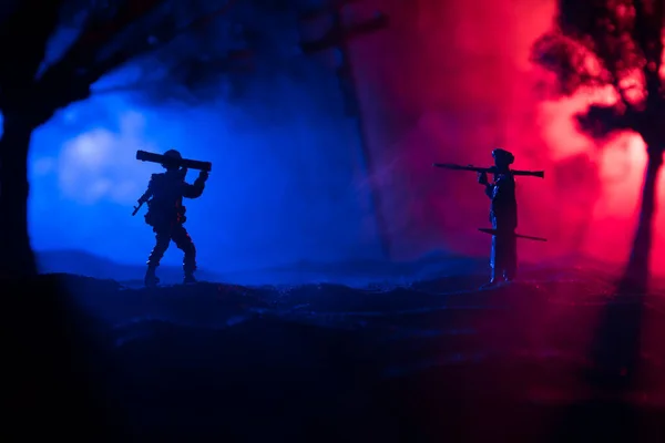 Military soldiers silhouettes with bazooka and rpg. War Concept. Military silhouettes fighting scene on war fog sky background, Mojahed with rpg and us soldier with bazooka at sunset. Attack scene