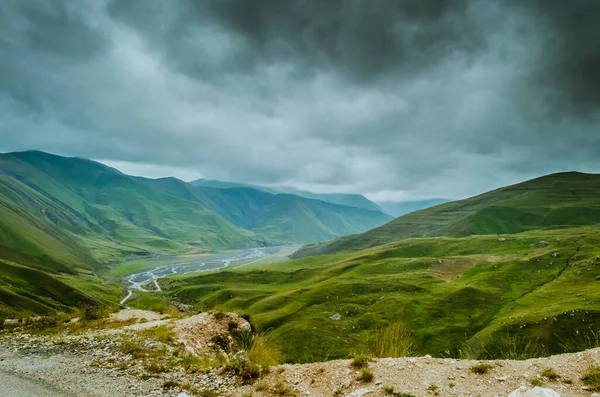 Cycling mountain road. Misty mountain road in high mountains.. Cloudy sky with mountain road. Azerbaijan nature