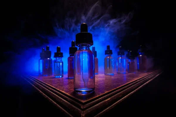 Vape Concept Smoke Clouds Vape Liquid Bottles Dark Background Light — Stock Photo, Image