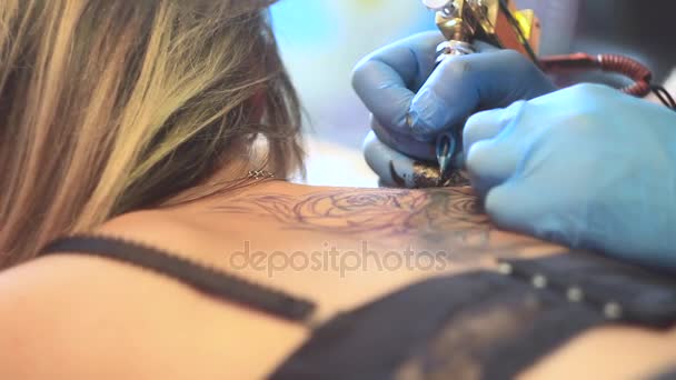 woman master tattoo on back
