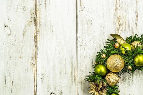 Christmas wreath on wooden door. Advent decoration with golden balls
