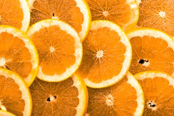 Textura de naranjas en rodajas, fondo natural — Foto de Stock