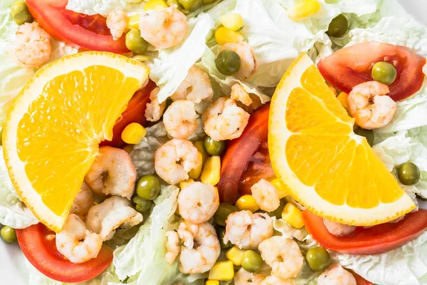 Colorful vegetable salad with shrimps and vegetables, mediterranean food concept