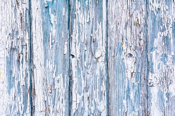 Fából készült háttér textúra. Régi deszkák pehely fehér festék, festék meghámozzuk és repedések. — Stock Fotó