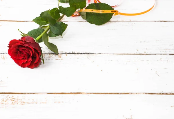 Red rose, valentines day card on wooden background Stock Image