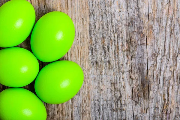 Easter background with green easter eggs, card with copy space