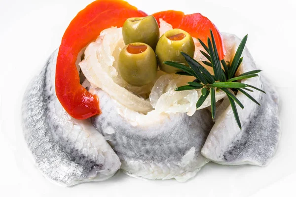 Marinated herrings on white plate, traditional polish appetizer — Stock Photo, Image