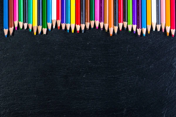 Colorful pencils on black, copy space, back to school concept — Stock Photo, Image