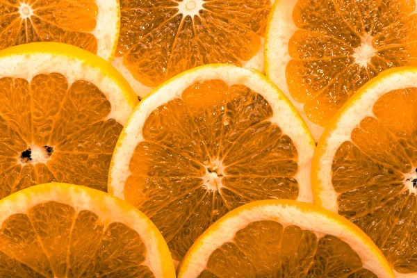 Fondo con frutas de naranja, rodajas, textura, macro — Foto de Stock