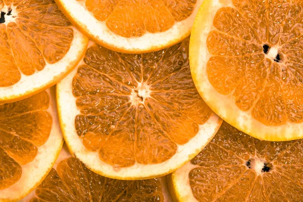 Фруктовая текстура из нарезанных апельсинов, натуральный фон — стоковое фото