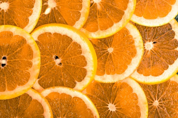 Naranjas en rodajas textura de la fruta, fondo natural — Foto de Stock