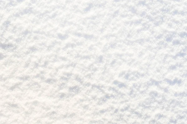 Textura blanca de nieve, superficie lisa de copos de nieve brillantes, fondo de invierno — Foto de Stock