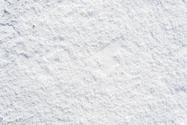 Ren snö textur, vintern bakgrund, vit yta med snöflingor — Stockfoto