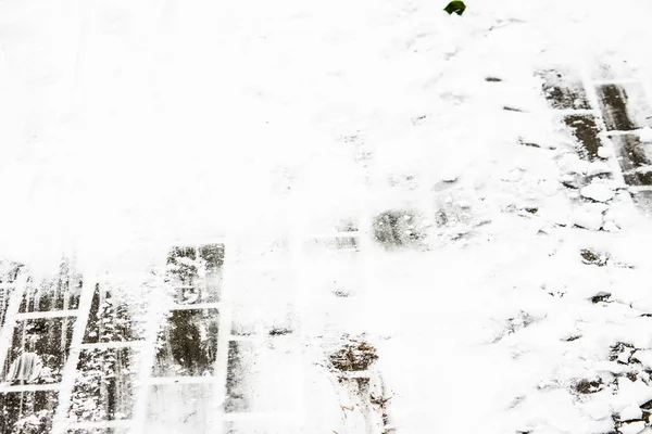 Háttér, a hó a télen, a textúra a járda sétány — Stock Fotó