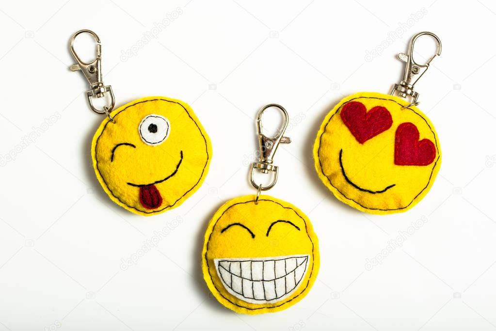 Happy smiley key rings emoticons isolated on white