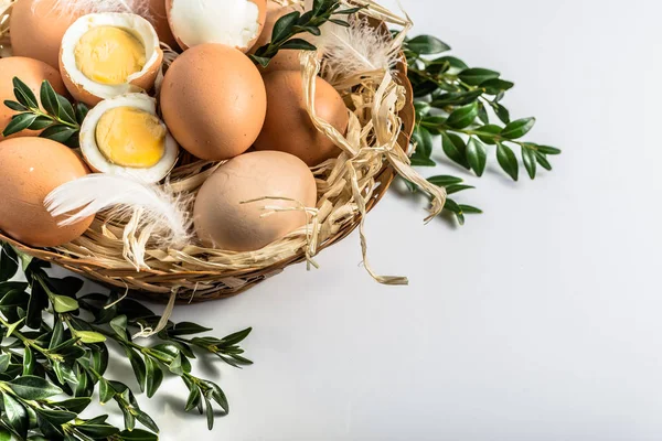 Easter eggs in easter basket on white background.