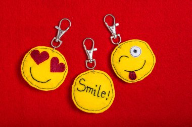 Yellow laughing happy smiley key rings - emoticons. clipart