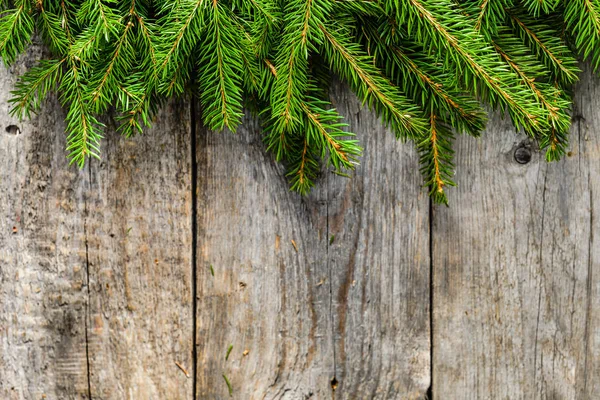 Wooden background with green fir frame, christmas decoration Stock Picture