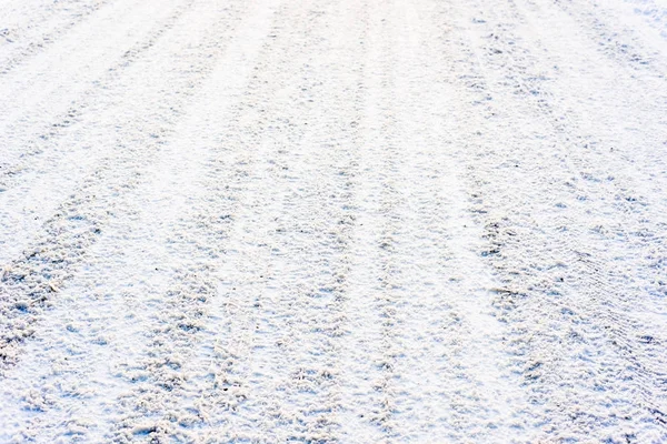 Route blanche en hiver, texture de la neige, fond — Photo