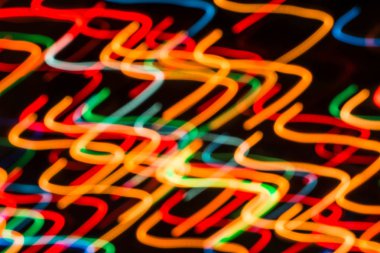 Işıkları gece bulanık hareket veya fireworks uygulamasında yeni yıl arifesinde arka plan