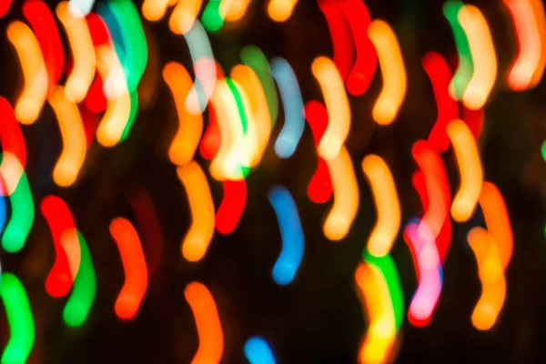 Tło z światła w niewyraźne ruchu w nocy lub fireworks w Sylwestra — Zdjęcie stockowe