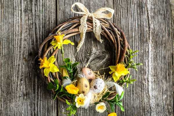 Easter background with spring wreath hanging on door