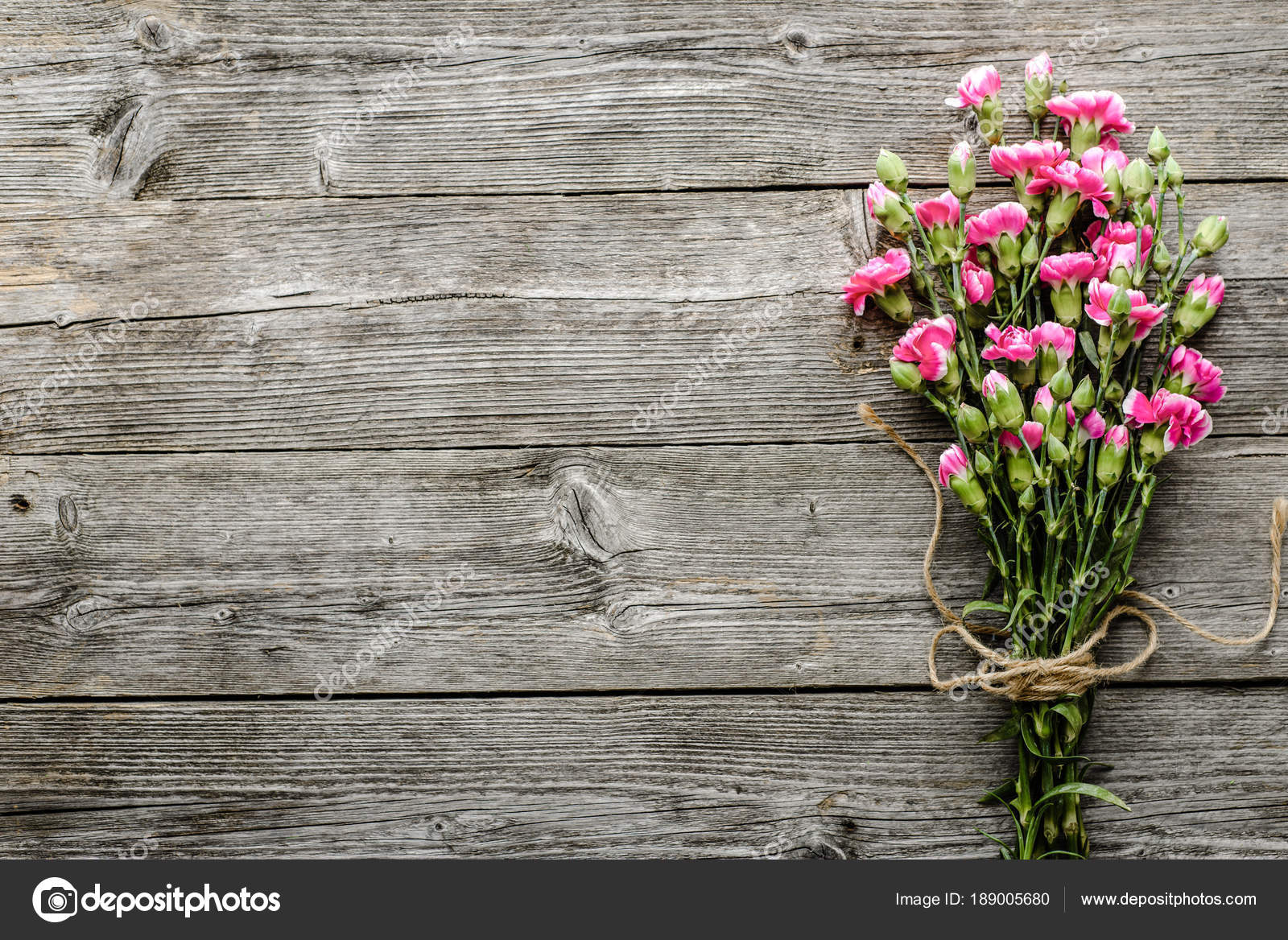 Old wooden background with flowers, bouquet on table, flat lay, overhead  Stock Photo by ©alicjane 189005680