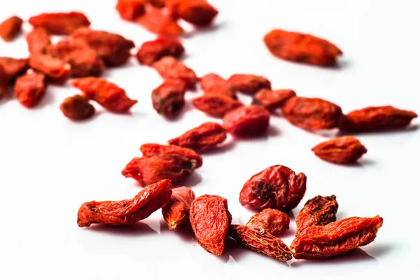 Goji berries on white background. Healthy food, superfood concept. — Stok fotoğraf
