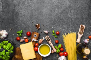 Italian food ingredients of spaghetti bolognese: pasta, tomatoes, basil, parmesan, herbs and spices