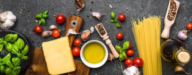 Italian food ingredients of spaghetti bolognese: pasta, tomatoes, basil, parmesan, herbs and spices