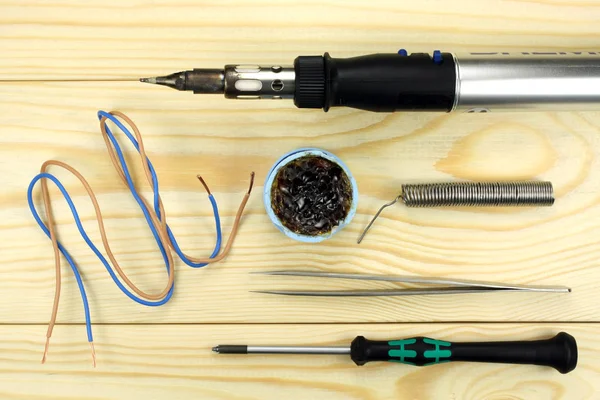 Gas soldering iron on a wooden table — Stock Photo, Image