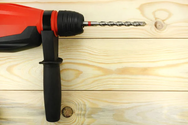 Hammer drill on a wooden table