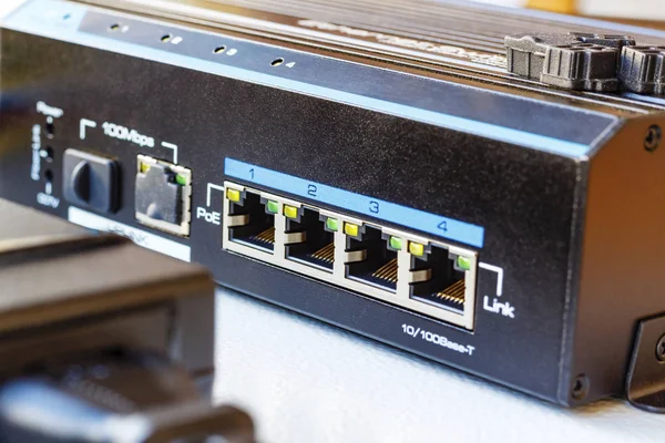 PoE ethernet switch installed on the mounting plate