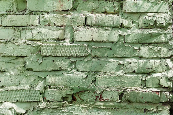 Green painted brick wall texture. Abstract brick wall background