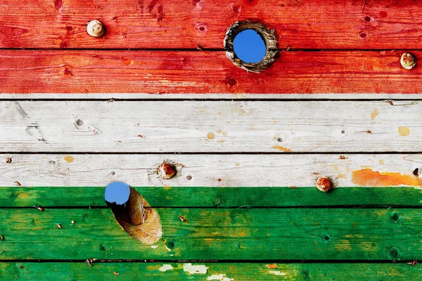 Hungary flag painted on old weathered boards