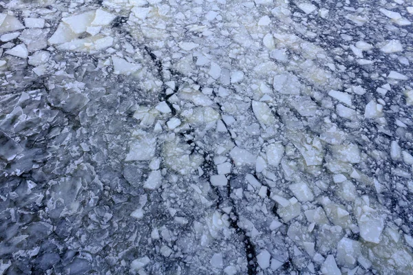 Broken ice on the surface of the river in winter. Ice floes texture — Stock Photo, Image