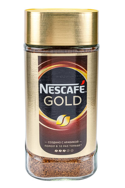 Moscow, Russia - January 20, 2020: Glass jar of granulated instant Nescafe Gold coffee with arabica flavor on white background. Front view